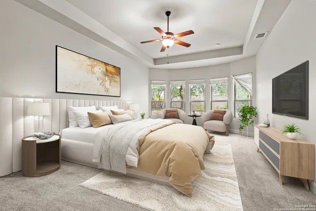 a bedroom with two beds and a flat screen tv