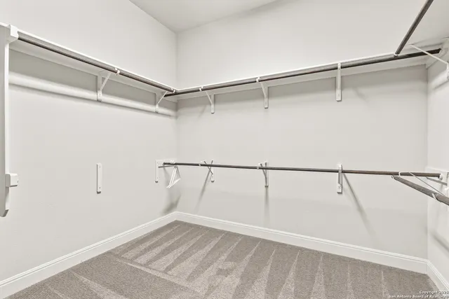 a view of an empty walk in closet