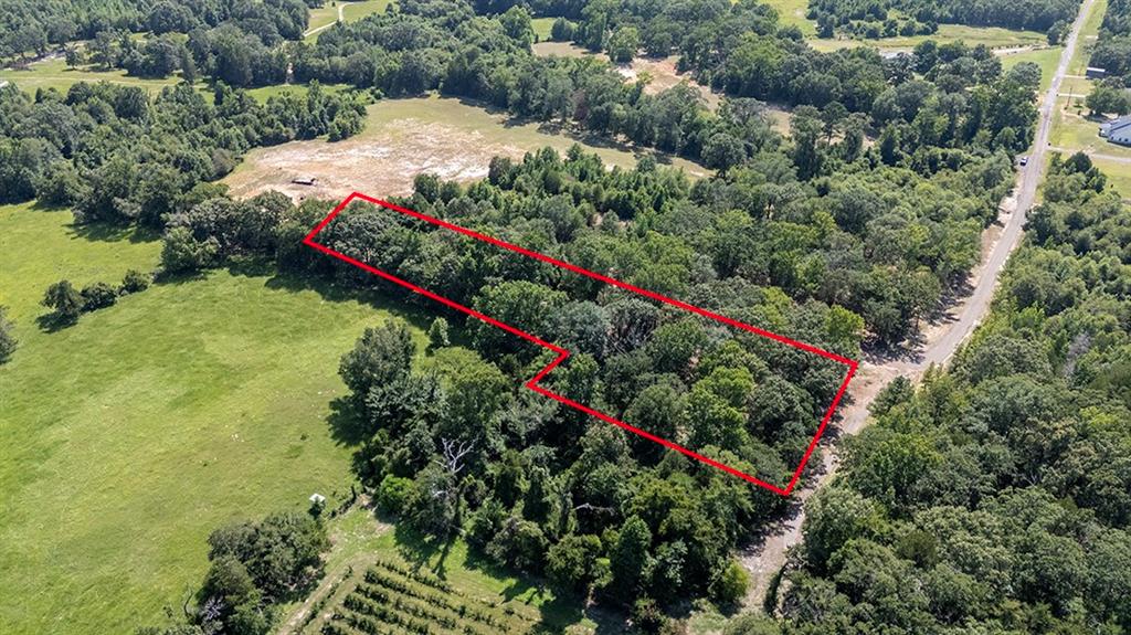 Tbd Lot 75 R Tbd Drive Murchison, TX 75778 - Photo 4 of 5 an aerial view of a houses with swimming pool and red chairs