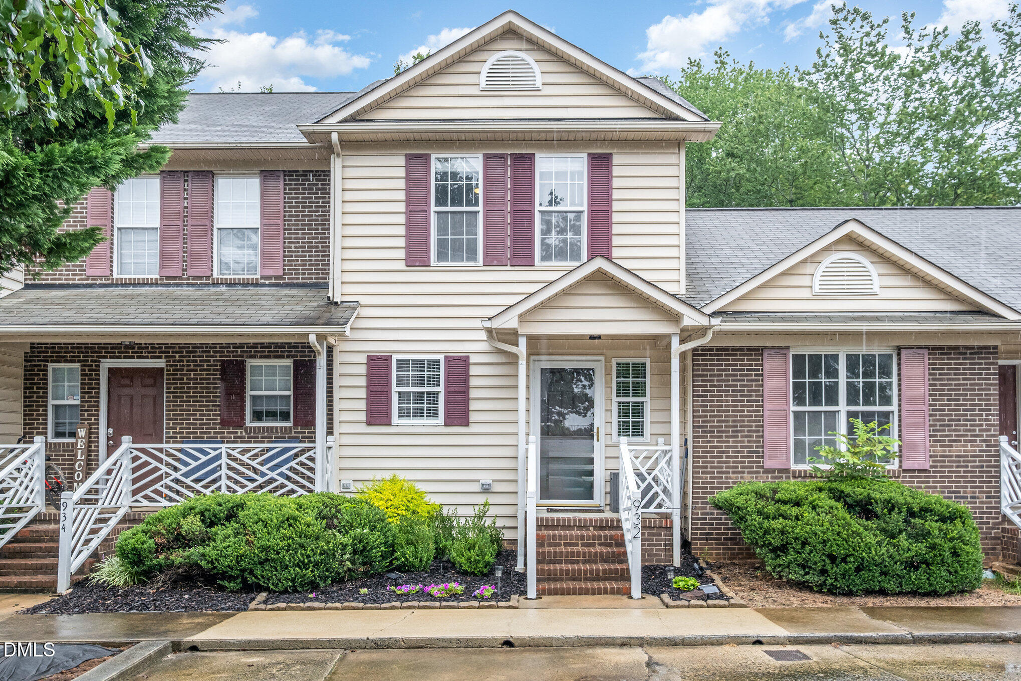 932 South 5th Street Mebane, NC 27302 - Photo 1 of 29 a view of a white house with large windows and a small yard