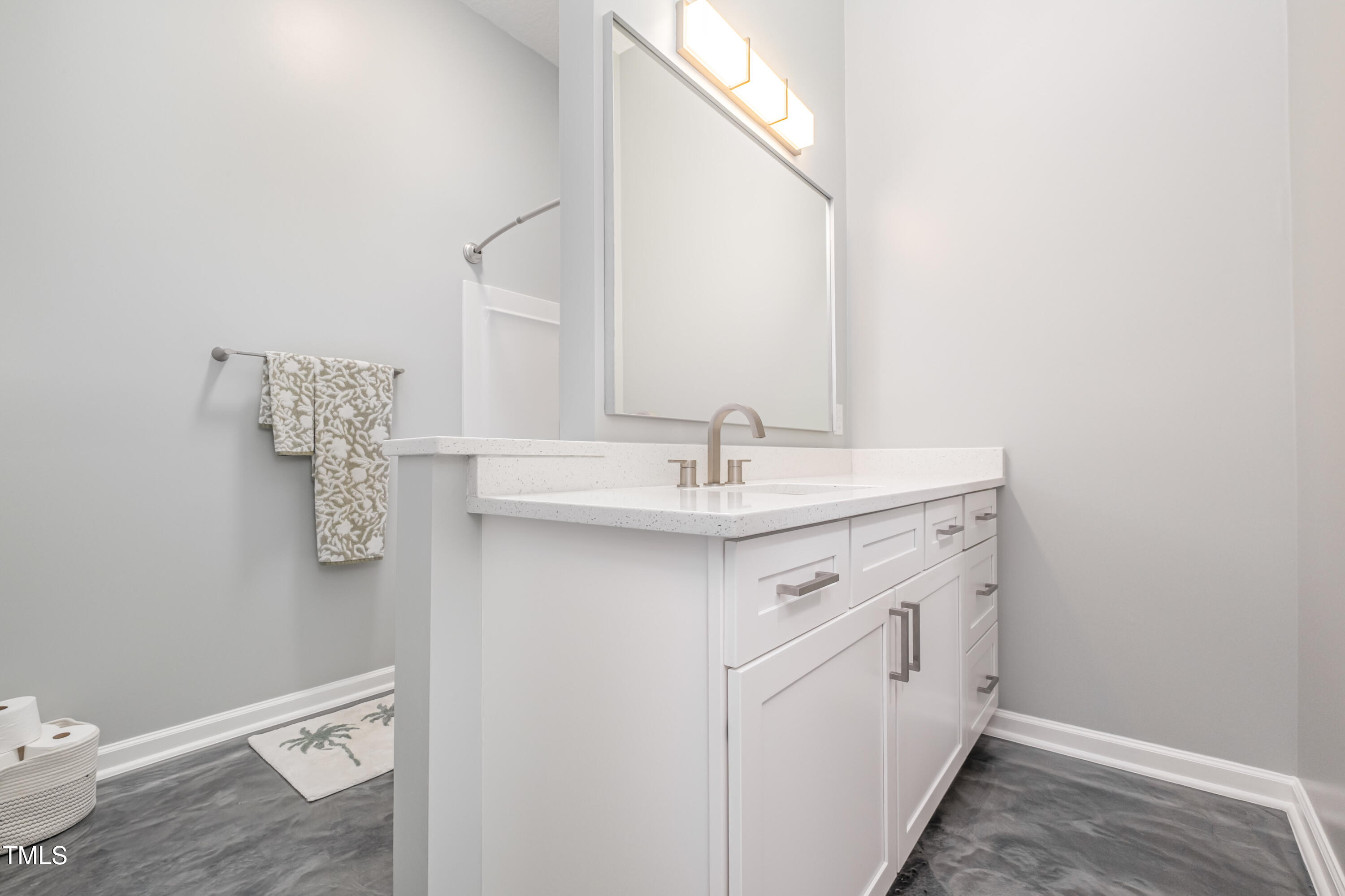 932 South 5th Street Mebane, NC 27302 - Photo 21 of 29 a spacious bathroom with a sink a toilet and mirror