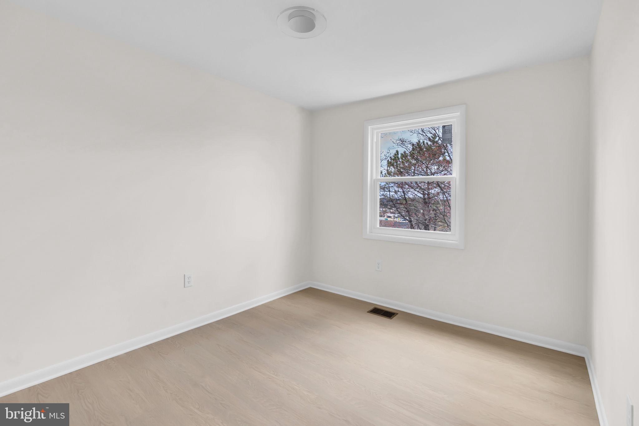 26 Timber Rock Road Gaithersburg, MD 20878 - Photo 18 of 36 an empty room with a window