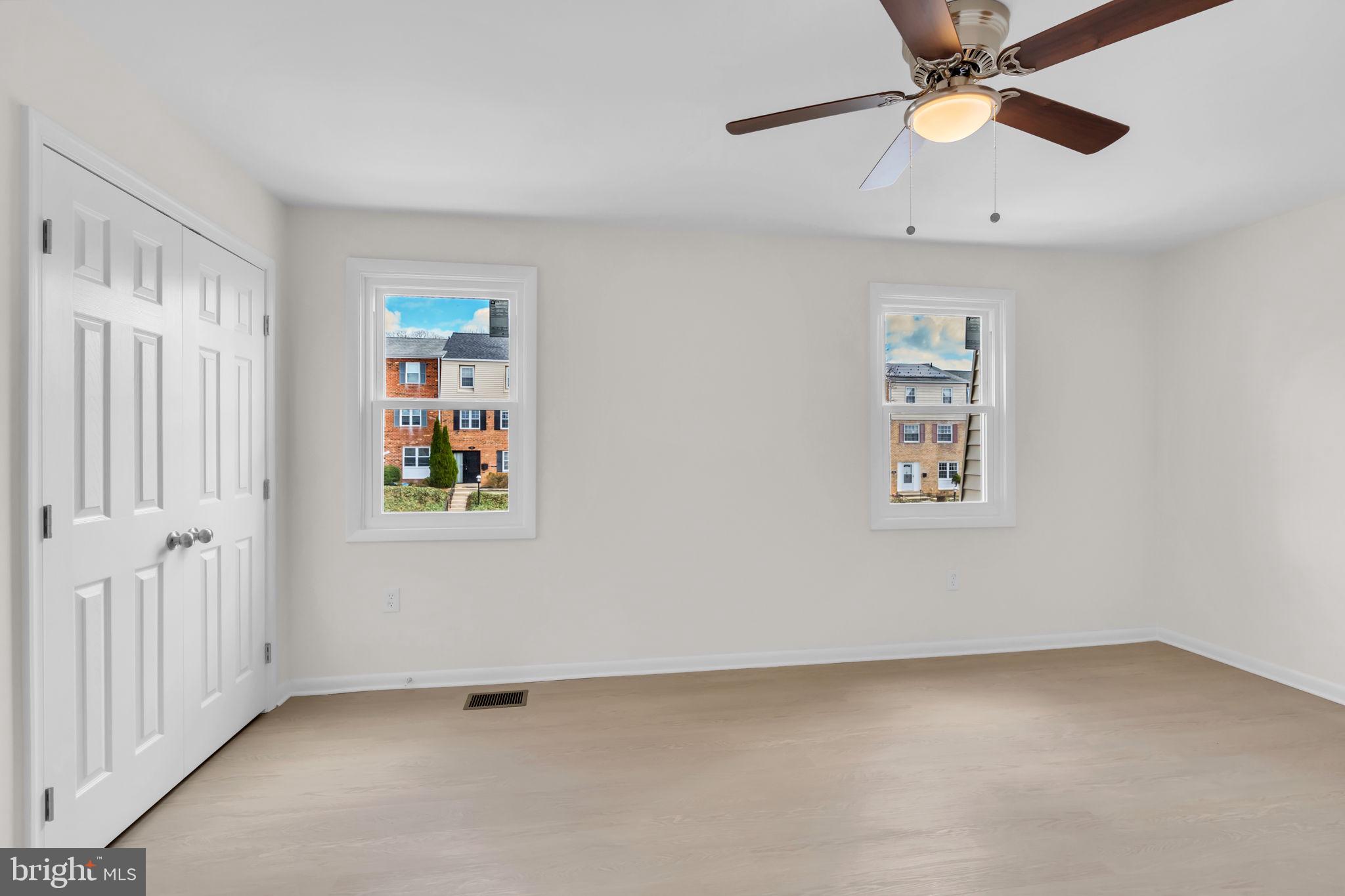 26 Timber Rock Road Gaithersburg, MD 20878 - Photo 21 of 36 wooden floor in an empty room with a window