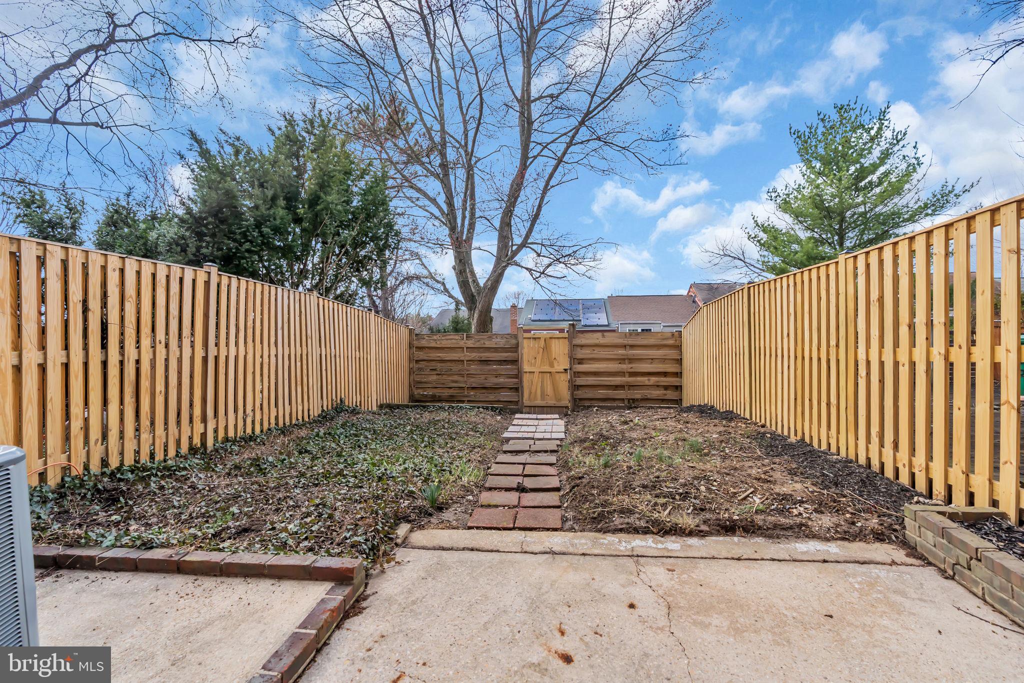 26 Timber Rock Road Gaithersburg, MD 20878 - Photo 30 of 36 a view of a yard with wooden fence