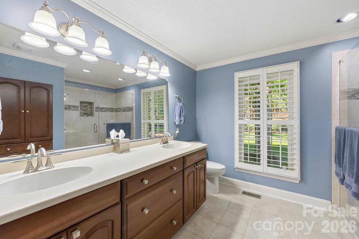 207 Lost Corner Road Morganton, NC 28655 - Photo 35 of 46 a bathroom with a sink double vanity and a mirror