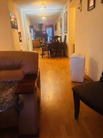 a blue bed sitting in a bedroom next to a window