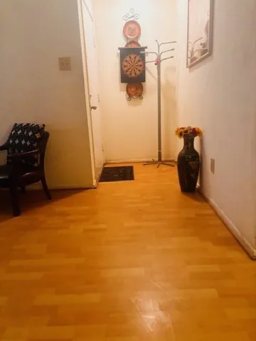 a bathroom with a granite countertop sink and washing machine