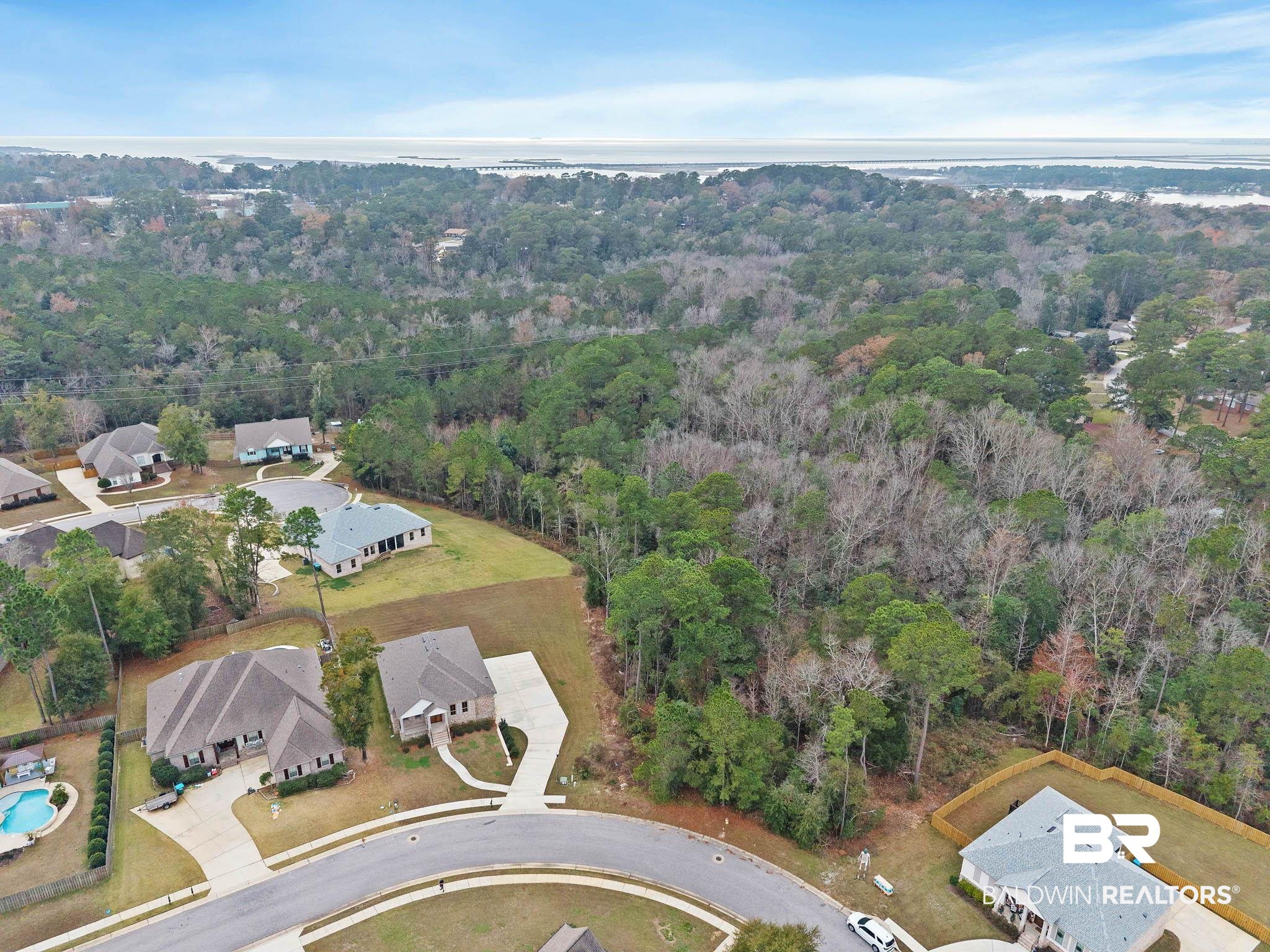 6656 Garrison Drive Daphne, AL 36527 - Photo 50 of 57 Aerial view of property's location with nearby suburban area and a forest