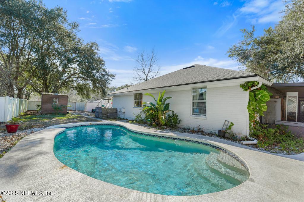 a view of a house with swimming pool