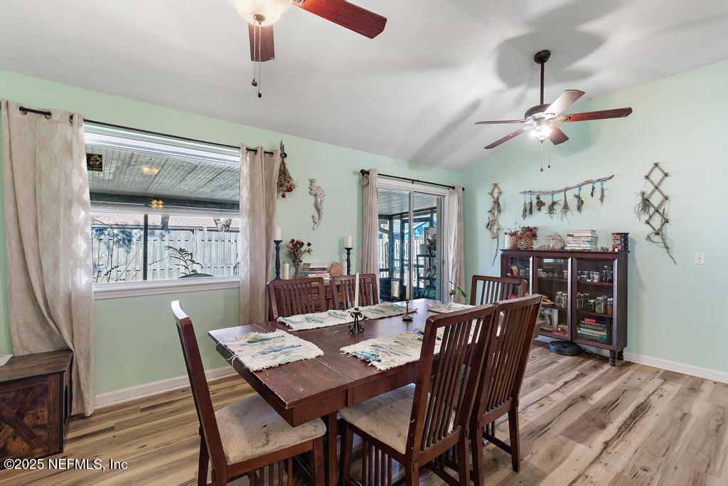 83096 St Mark Drive Yulee, FL 32097 - Photo 11 of 35 a view of a dining room with furniture window and wooden floor