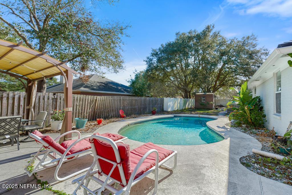 83096 St Mark Drive Yulee, FL 32097 - Photo 24 of 35 a backyard of a house with table and chairs