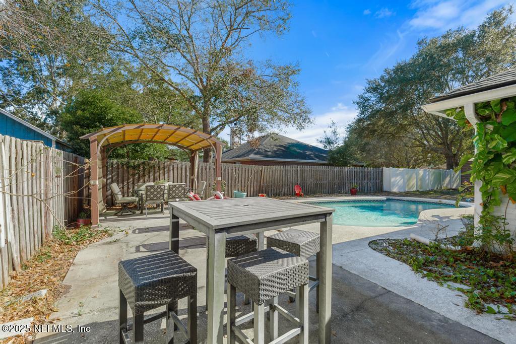 83096 St Mark Drive Yulee, FL 32097 - Photo 26 of 35 a view of backyard with seating and green space