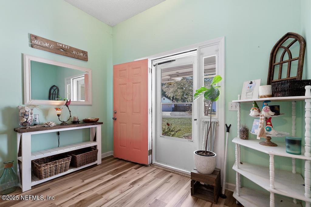 83096 St Mark Drive Yulee, FL 32097 - Photo 6 of 35 a view of workspace with wooden floor and bedroom view