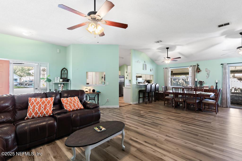 83096 St Mark Drive Yulee, FL 32097 - Photo 9 of 35 a living room with furniture and wooden floor