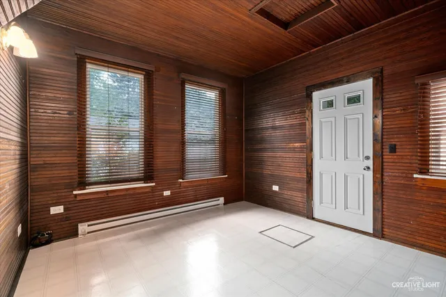 a room with cabinets and chair
