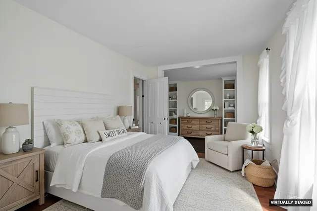 a spacious bedroom with a large bed and a couch