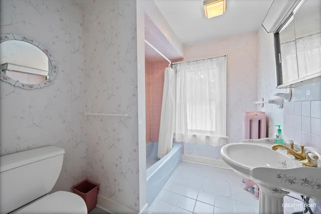 a bathroom with a granite countertop sink mirror and double