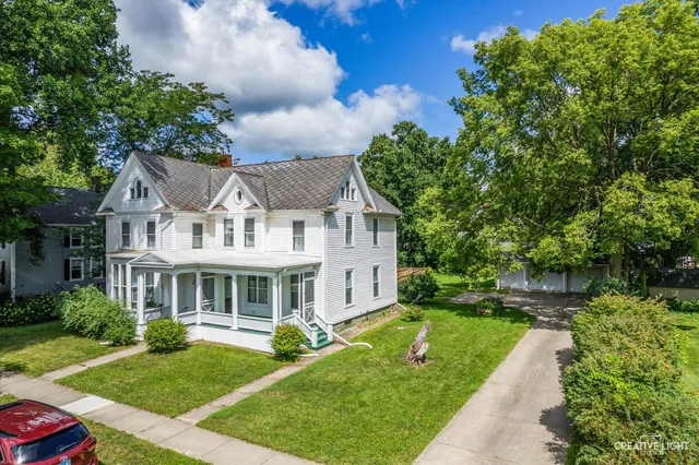an aerial view of a house with a yard