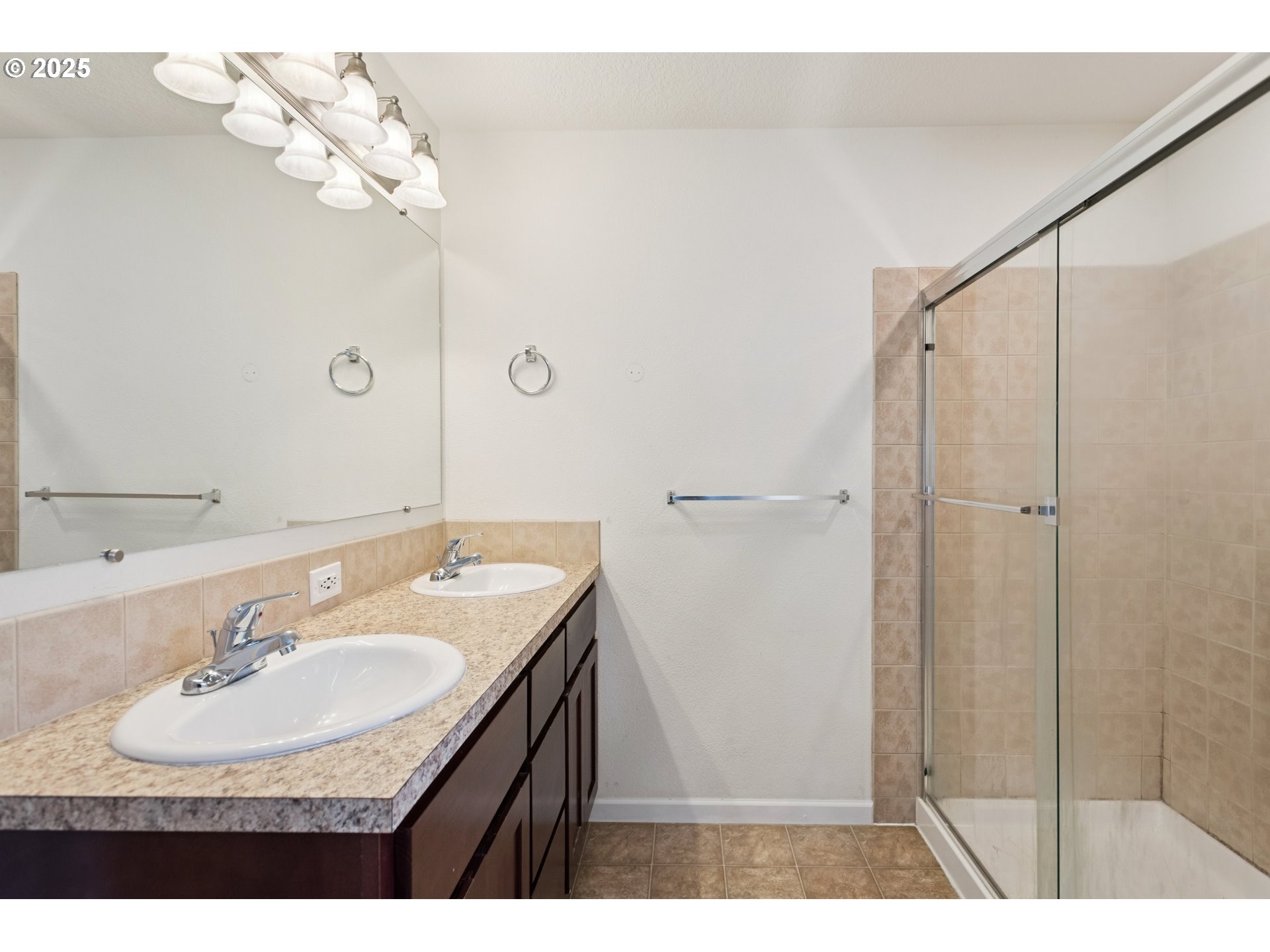 18232 Southwest Orlov Court Beaverton, OR 97078 - Photo 12 of 15 a bathroom with a sink vanity granite tub shower and a mirror