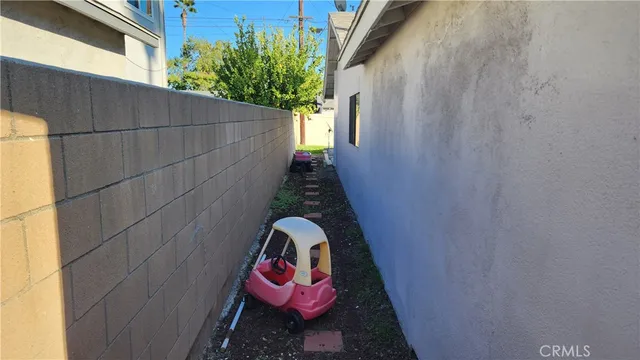 a bathroom with a toilet and a shower curtain