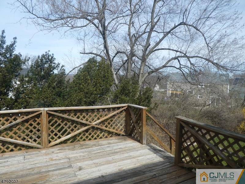 4 Lexington Road Somerset, NJ 08873 - Photo 14 of 14 a view of entryway with wooden floor and fence