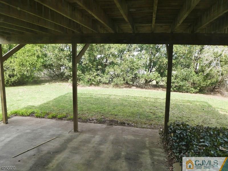 4 Lexington Road Somerset, NJ 08873 - Photo 7 of 14 a view of a yard with porch and outdoor space
