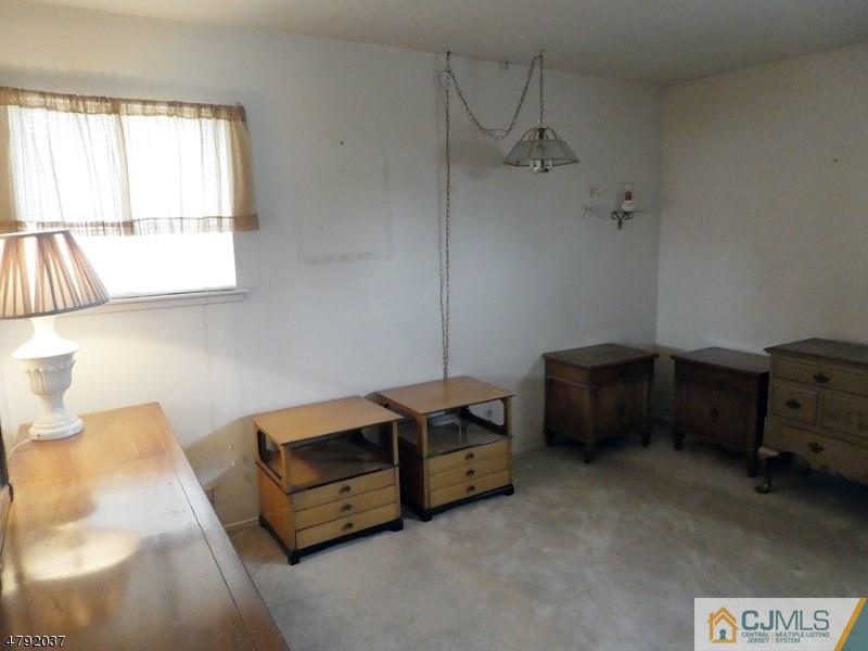 4 Lexington Road Somerset, NJ 08873 - Photo 8 of 14 a living room with furniture and a window