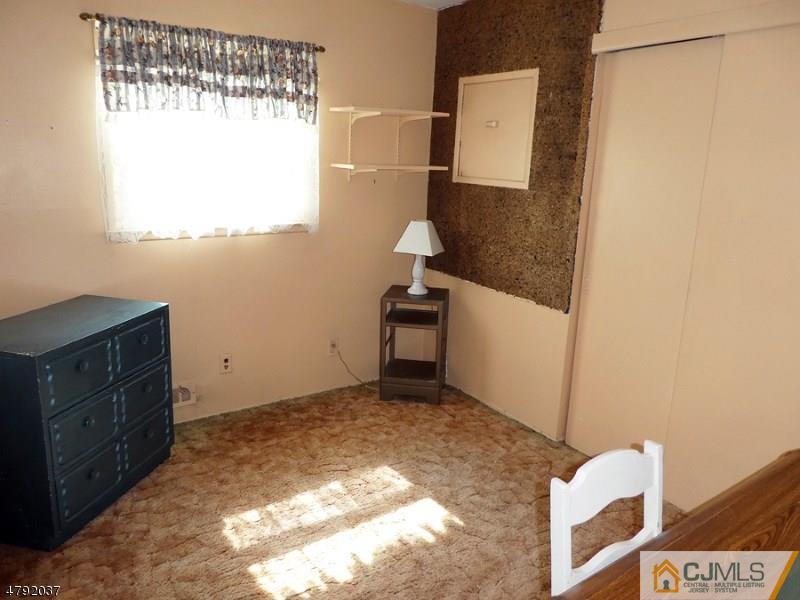 4 Lexington Road Somerset, NJ 08873 - Photo 10 of 14 a bathroom with a bathtub sink and mirror
