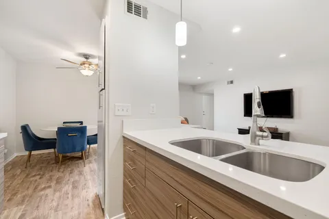 a kitchen with stainless steel appliances a stove a microwave and cabinets
