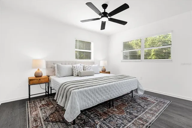 a bed room with a bed and a chandelier