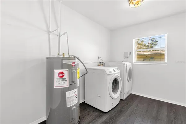 a utility room with dryer and washer
