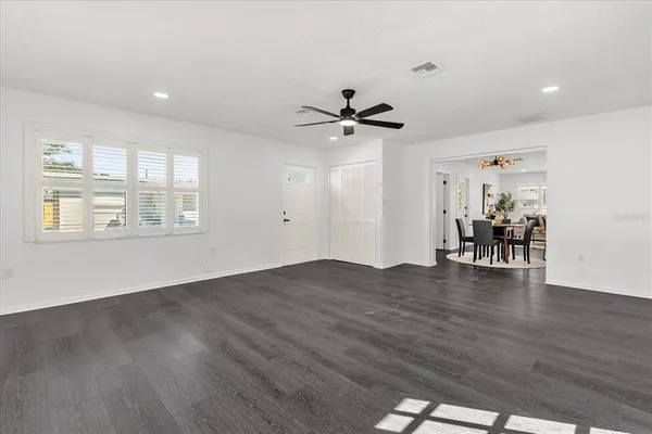 a view of livingroom with hardwood floor and a ceiling fan