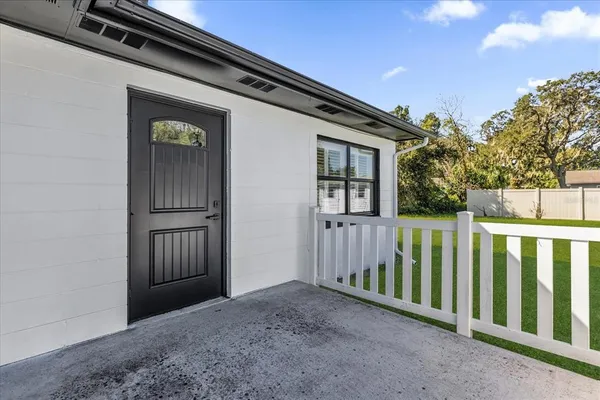 a view of an entryway with wooden floor