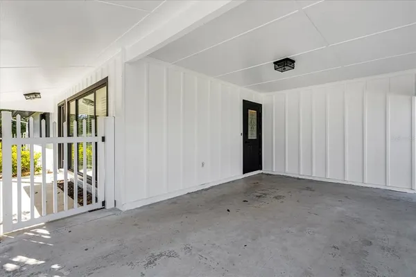 a front view of house with a garden