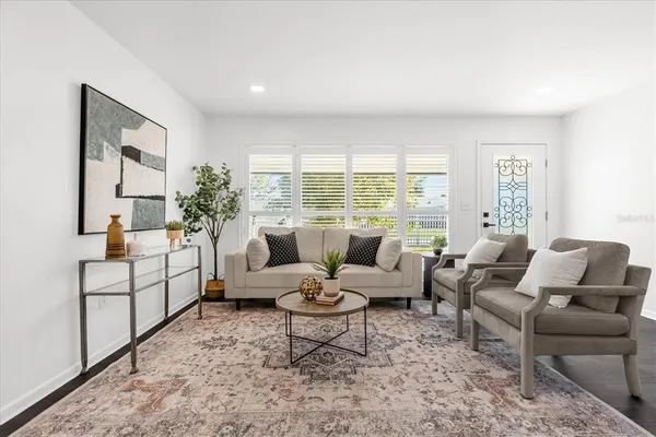 a living room with furniture and a large window