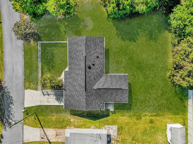 an aerial view of residential houses with outdoor space