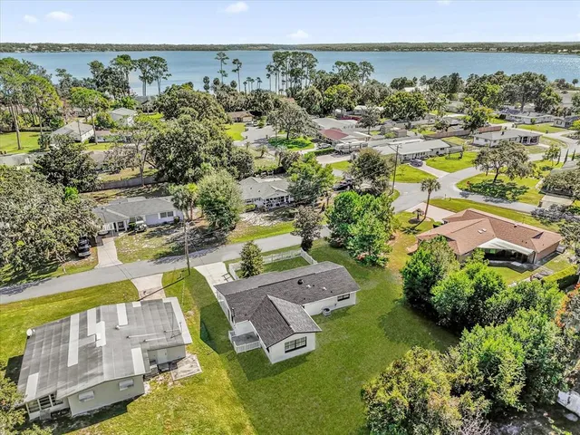 an aerial view of a house with a garden
