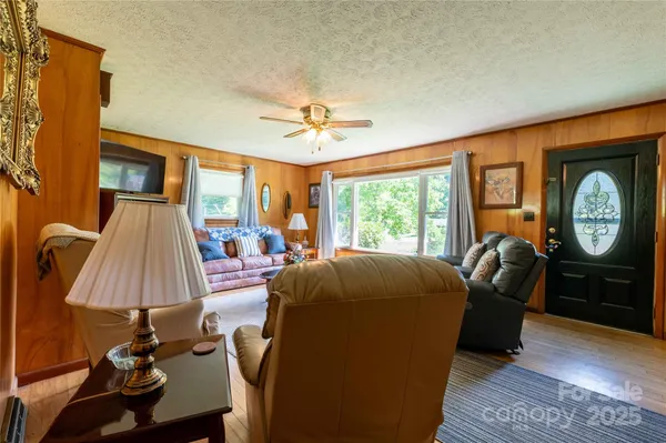 a bed room with furniture and a window