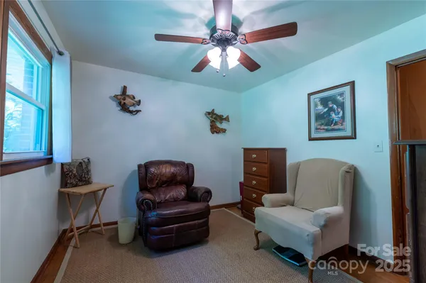 a living room with furniture and a window