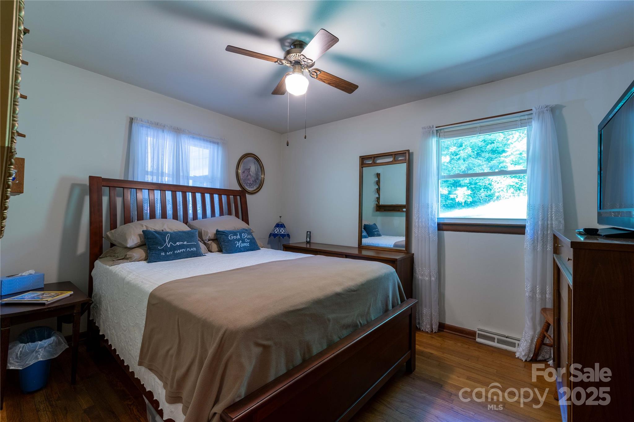 40 Double Island Road Burnsville, NC 28714 - Photo 18 of 28 a bedroom with a bed and a flat screen tv