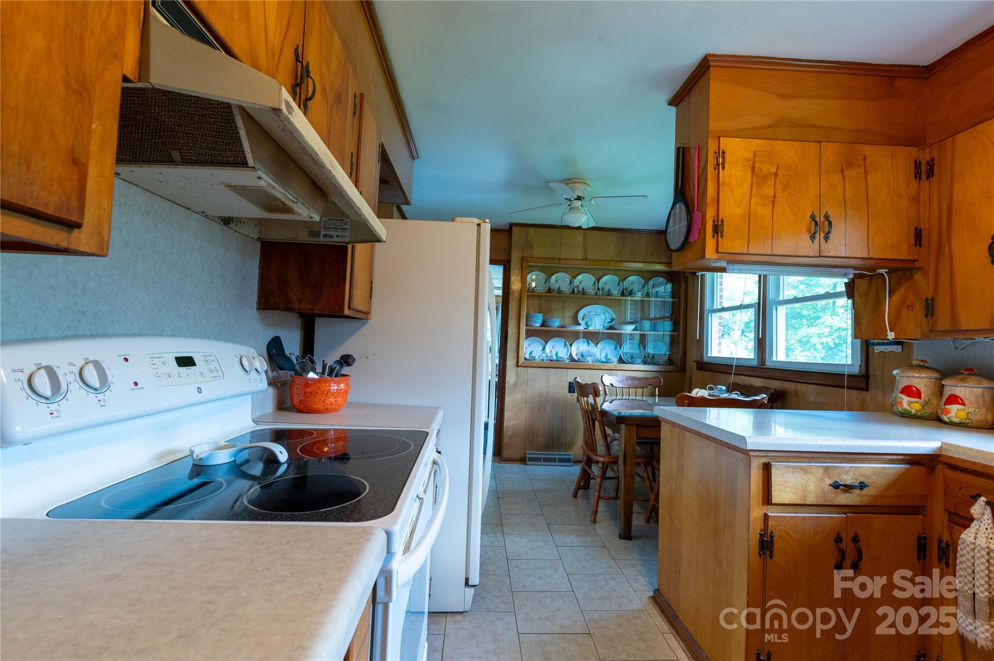 40 Double Island Road Burnsville, NC 28714 - Photo 21 of 28 a kitchen with a sink a stove and a refrigerator