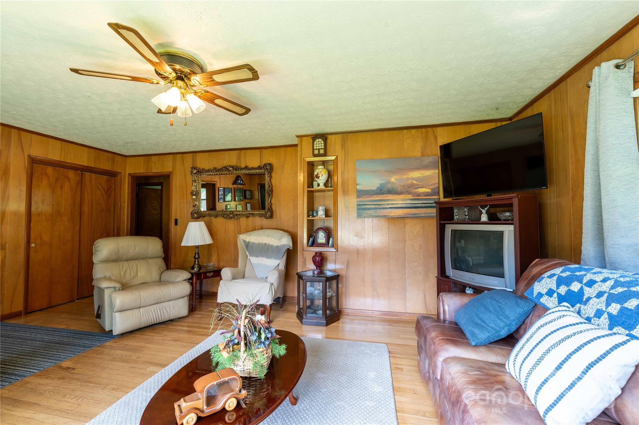 40 Double Island Road Burnsville, NC 28714 - Photo 8 of 28 a living room with furniture and a flat screen tv