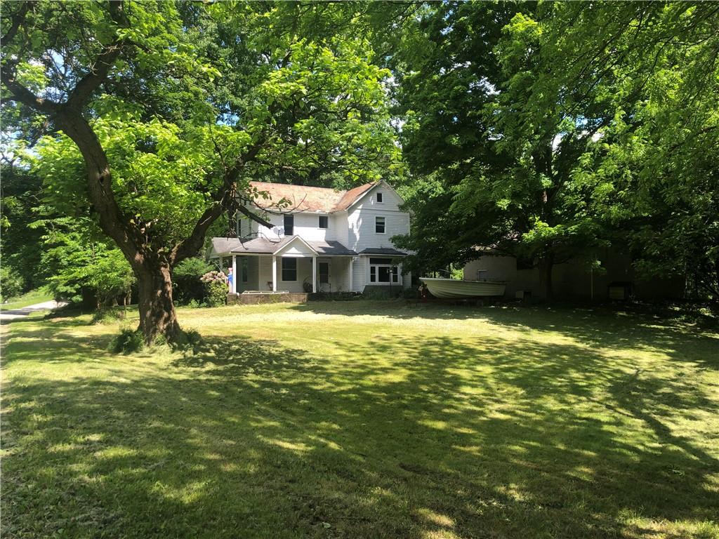752 Evergreen Road Edinburg, PA 16116 - Photo 2 of 31 a front view of a house with a yard