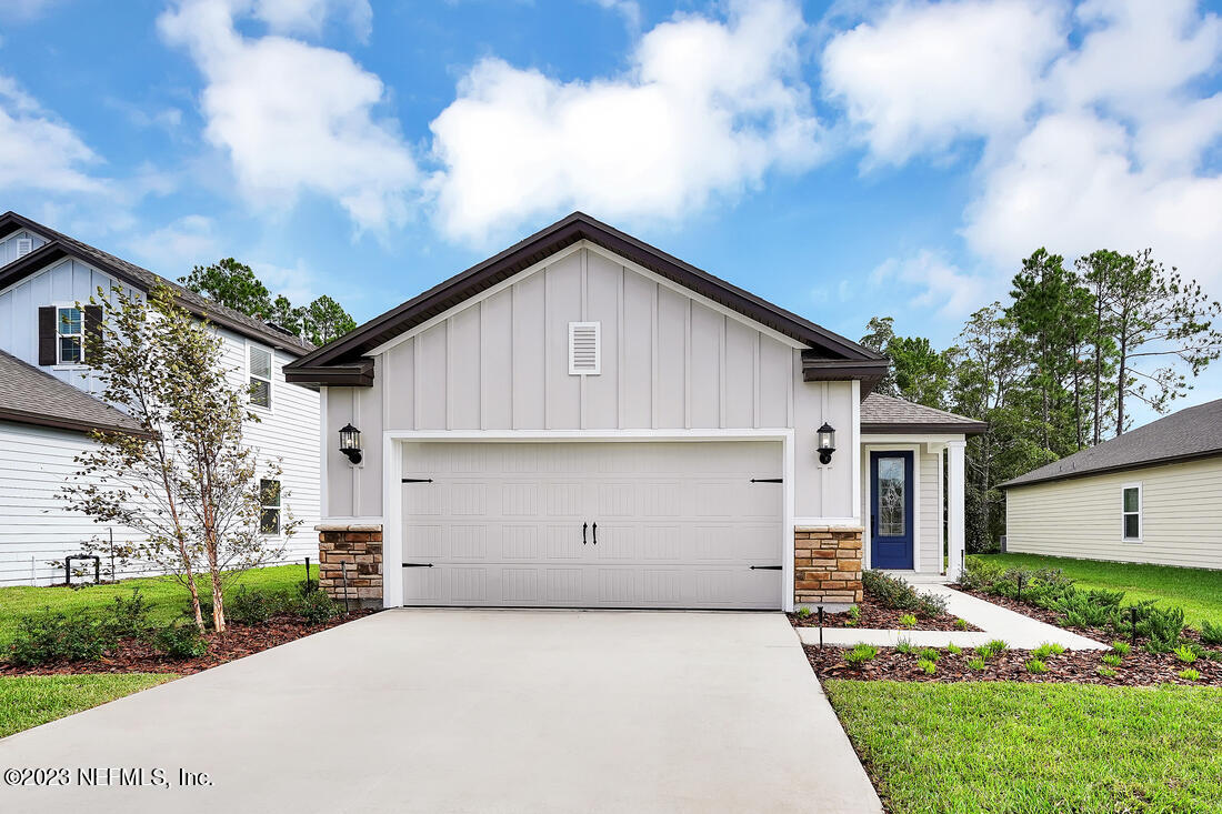 865 Morgans Treasure Road St. Augustine, FL 32084 - Photo 1 of 9 a view of garage and yard