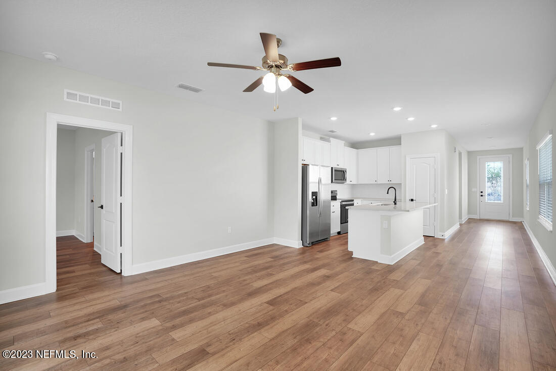 865 Morgans Treasure Road St. Augustine, FL 32084 - Photo 4 of 9 a view of a kitchen and wooden floor