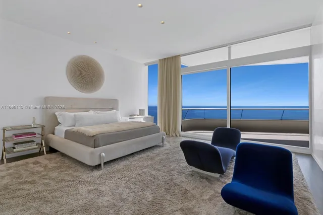 a bedroom with a bed and chair