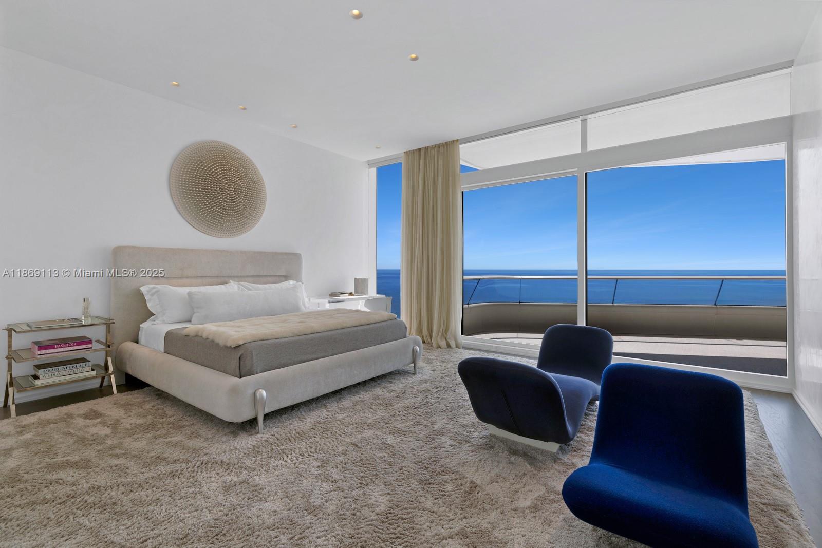 3315 Collins Avenue, Unit 10B Miami Beach, FL 33140 - Photo 12 of 42 a bedroom with a bed and chair