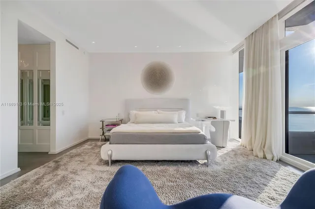 a spacious bedroom with a bed and window