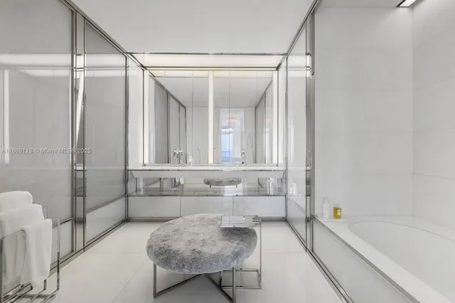 a bathroom with a tub shower and sink