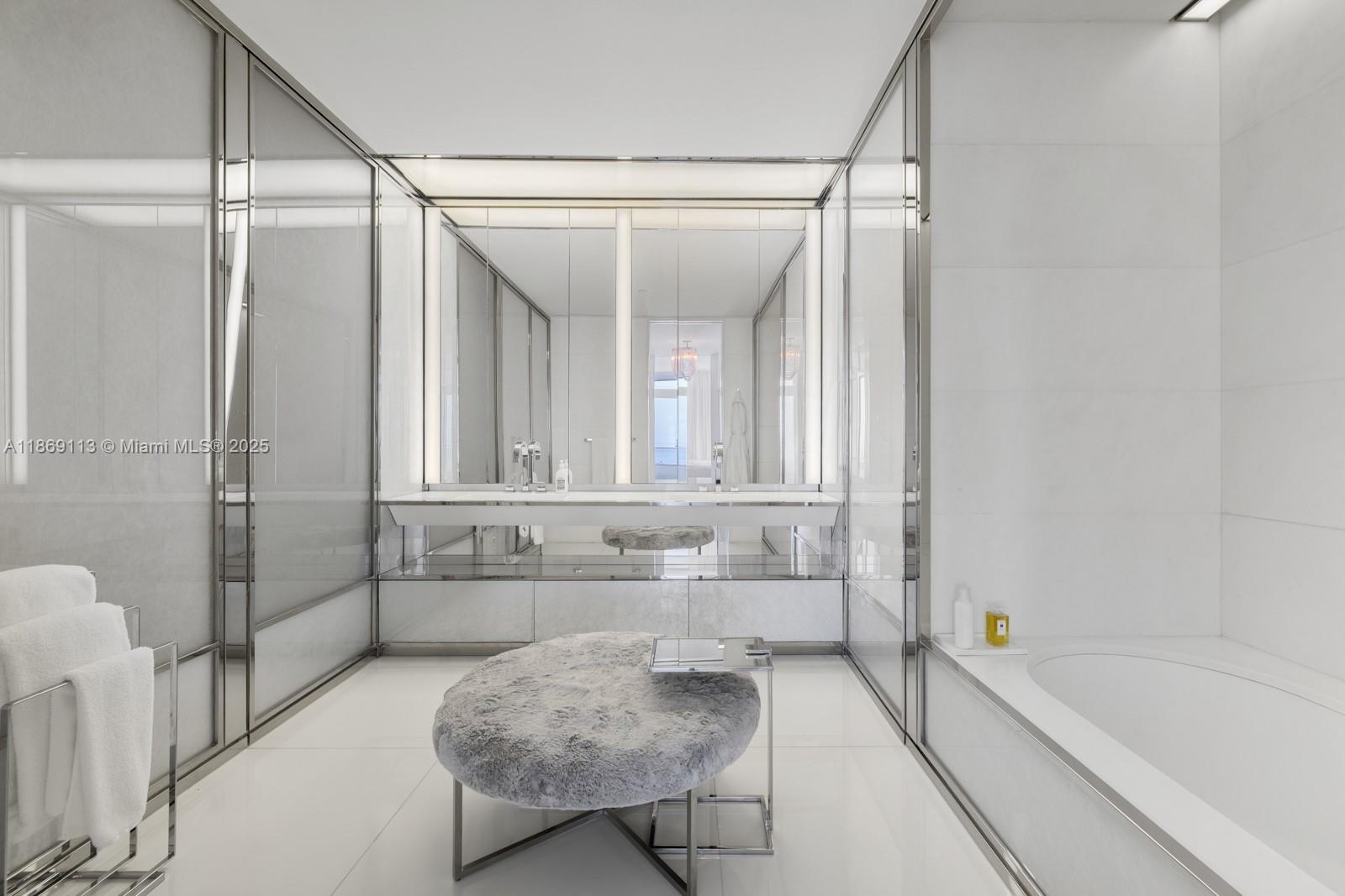 3315 Collins Avenue, Unit 10B Miami Beach, FL 33140 - Photo 16 of 42 a bathroom with a tub shower and sink